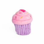A plush cupcake toy with pink frosting, colorful embroidered sprinkles, and a purple ribbed wrapper, centered on a plain white background - perfect squeaky toy for dogs.