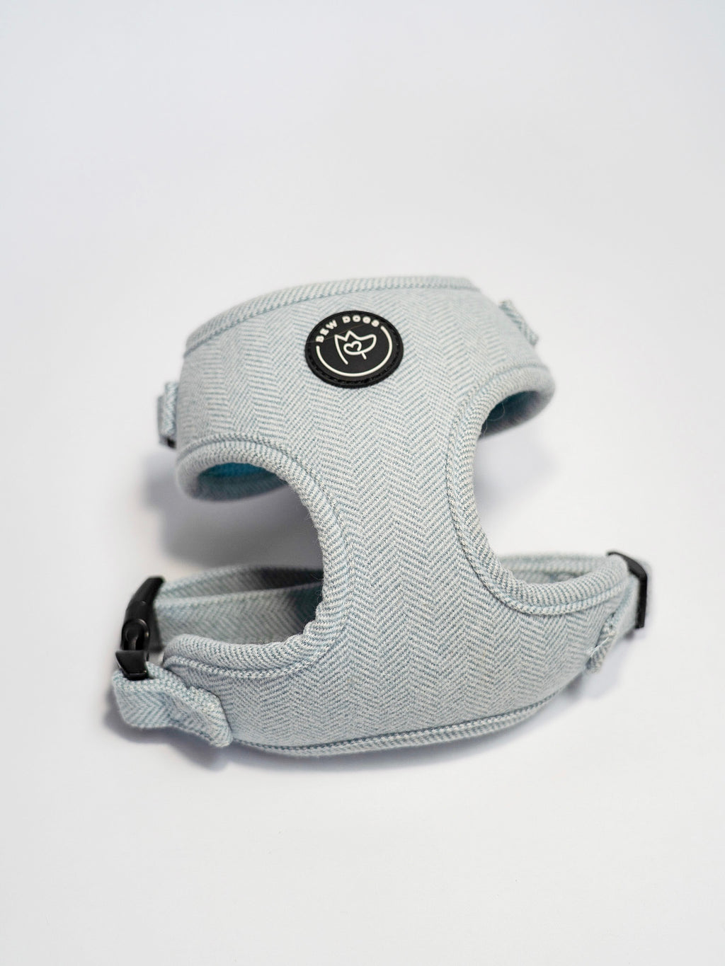 Baby blue dog harness with a Bew Dogs brand logo on a white background - high quality and adjustable