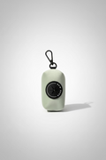 a lush sage green velvet dog poo bag holder with clip, in a studio shot against a grey background