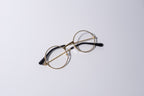 Round eyeglasses with gold frame, fun novelty item for cats and dogs, on a white background