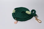 Dark Green rope dog leash with gold clasp and Bew Dogs tag on a light grey background