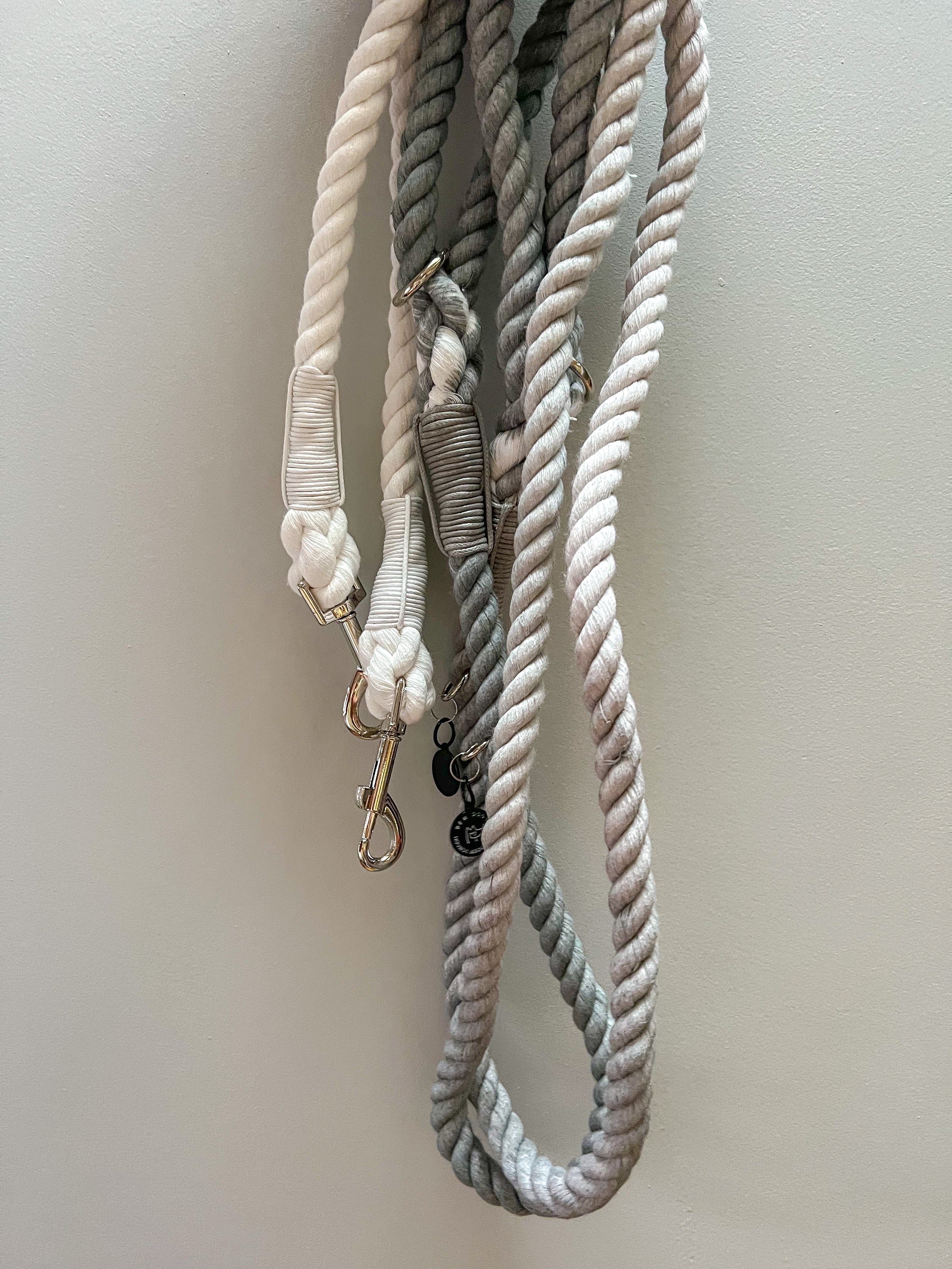 grey and white ombre two tone dog leads with silver metal clasp, held in front of a grey background, showing a stylish and durable lead for all dogs.