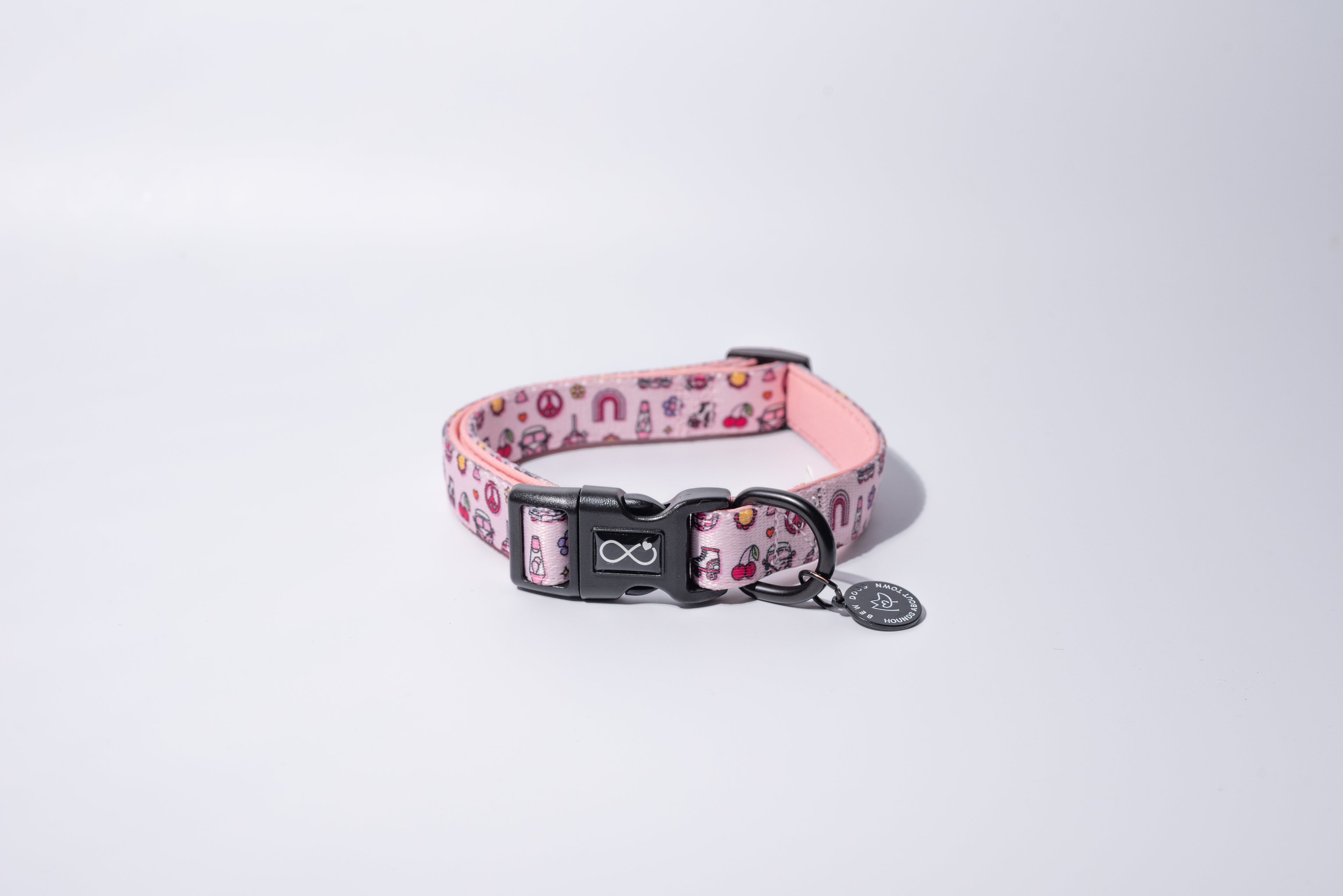 a pink neoprene dog collar from bew dogs, sits on a white background