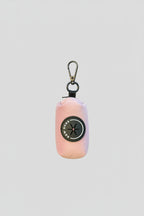 a rose pink velvet poo bag holder, shown in a studio against a white background