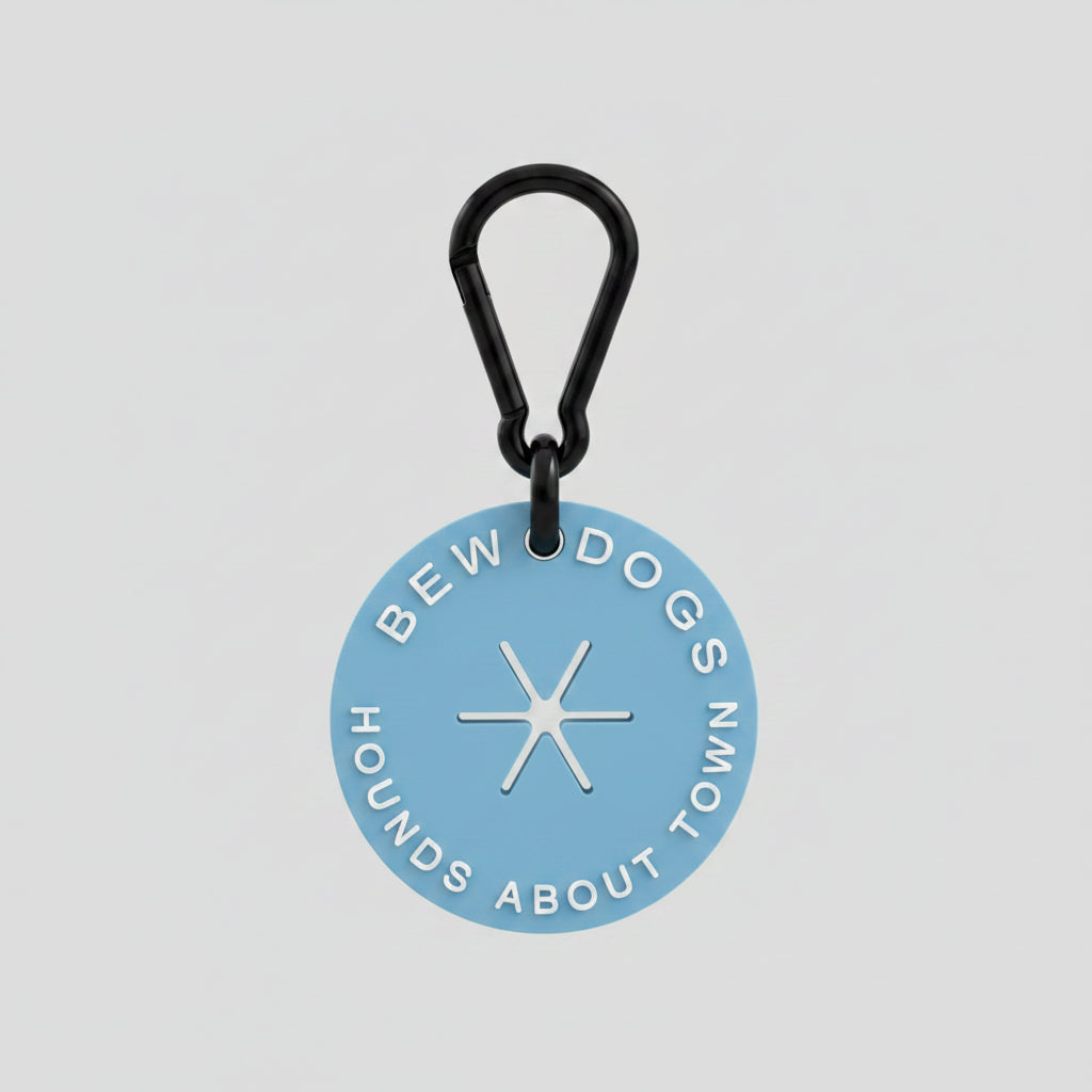a sky blue poop loop from bew dogs, with a black secure clasp, a dog walking essential shown against a white background