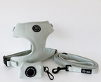 a mint green fabric harness bundle with soft matching lead and matching poo bag holder is shown against a white background