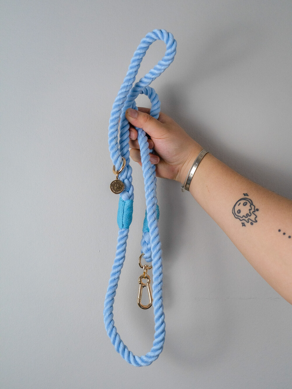 Sky Blue Rope Lead being held against a white background.