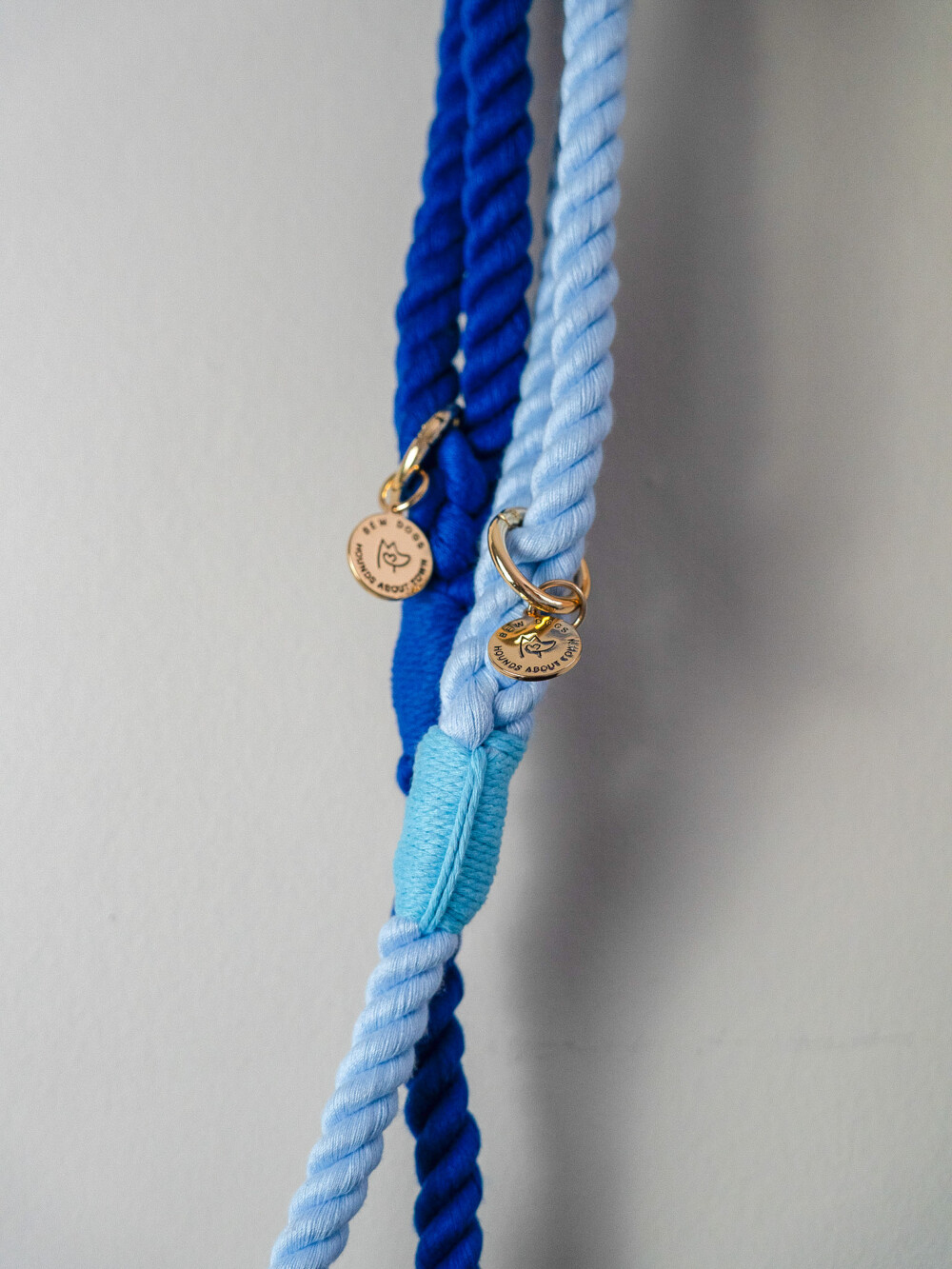 Two blue rope leads, one sky blue and one navy blue against a white background.