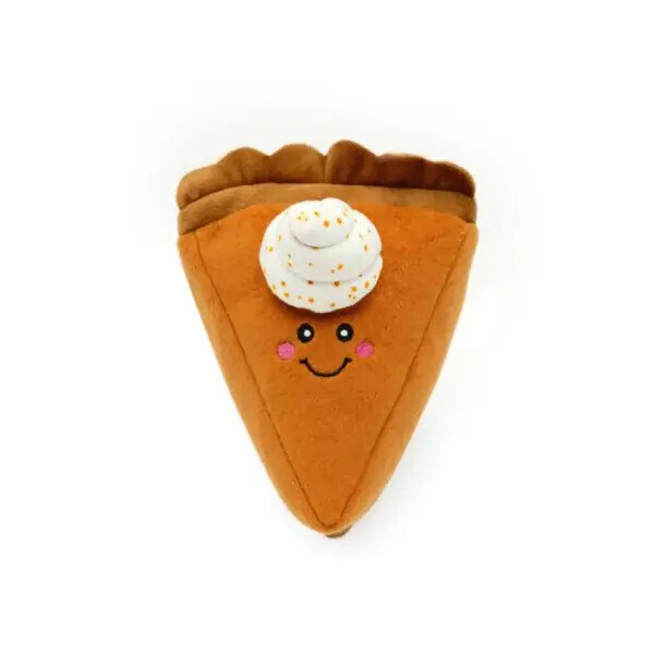 a soft, plush autumn dog toy shaped as a large piece of pumpkin pie with a dollop of cream, against a white background.