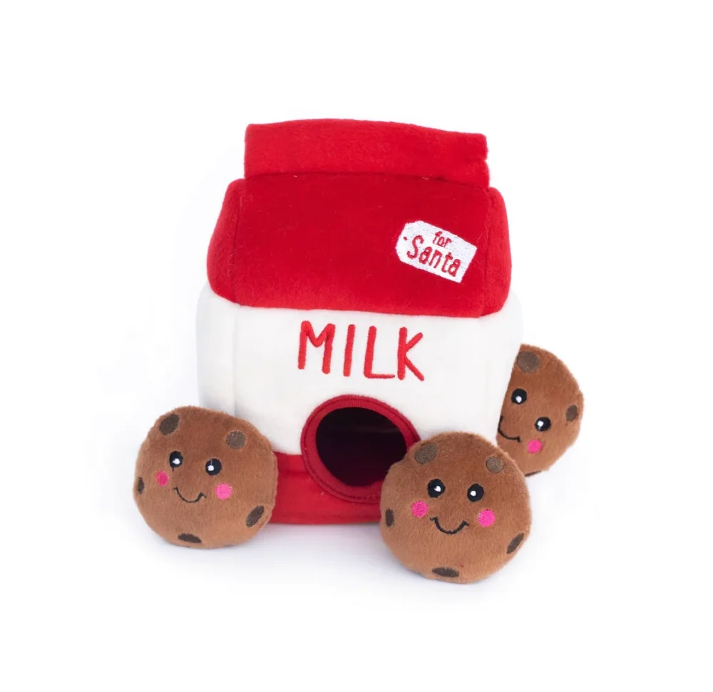 an enrichment dog burrow toy, featuring three squeaky cookies which are hidden inside a red milk carton, which says For Santa, in front of a white background