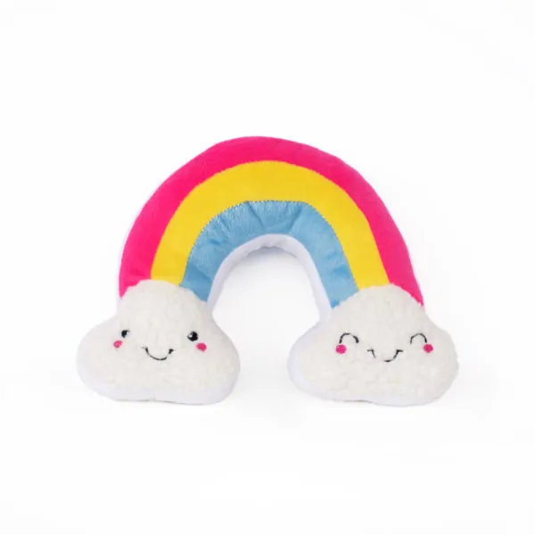 a plush rainbow dog toy, with smile faces inside clouds at the end of the rainbow, against a white background