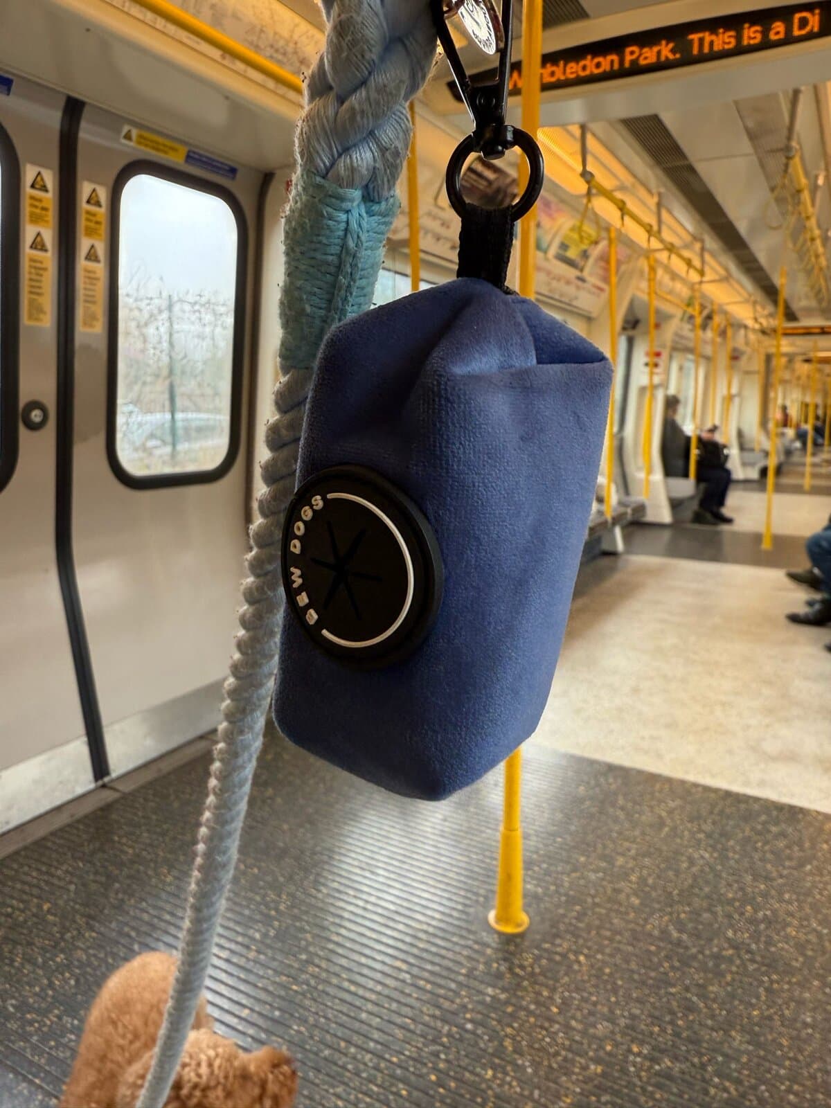 Poo Bag Holder on public transport for dog owners, Midnight Velvet colour.